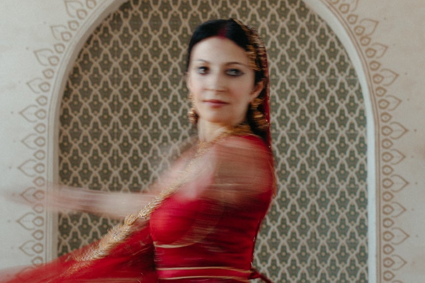 Photo of woman dancing with motion blur