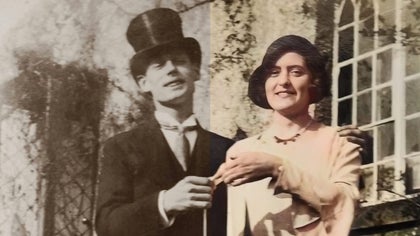 Black-and-white photo of a man and woman from an earlier era, restored with color and improved detail