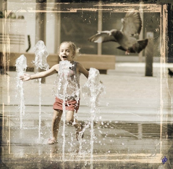 Kid playing Water Fountain