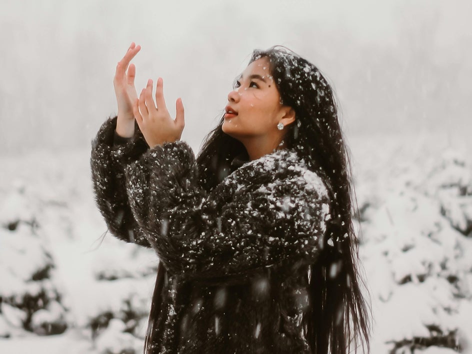 Before adding a color grading effect to a winter snow portrait in BeFunky