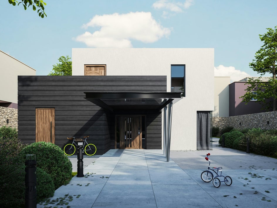 Modern home with bikes in the front driveway