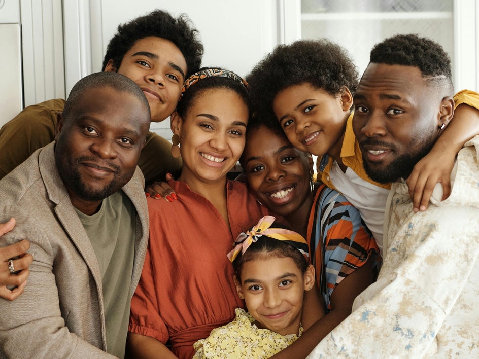 Big family posed together in tight group