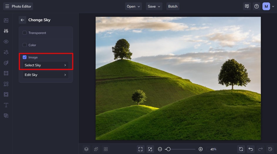 Sky selection menu in sky replacer with a bright blue sky applied to a green hill landscape