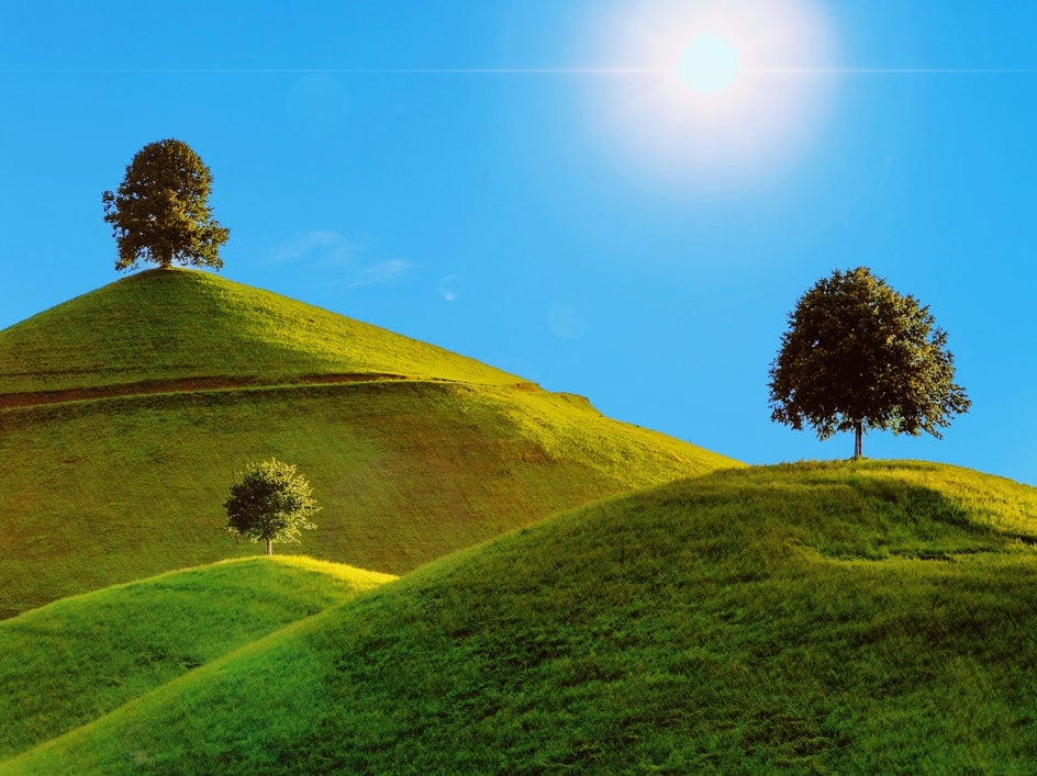 Bright blue sky and sun to evoke feeling of summer