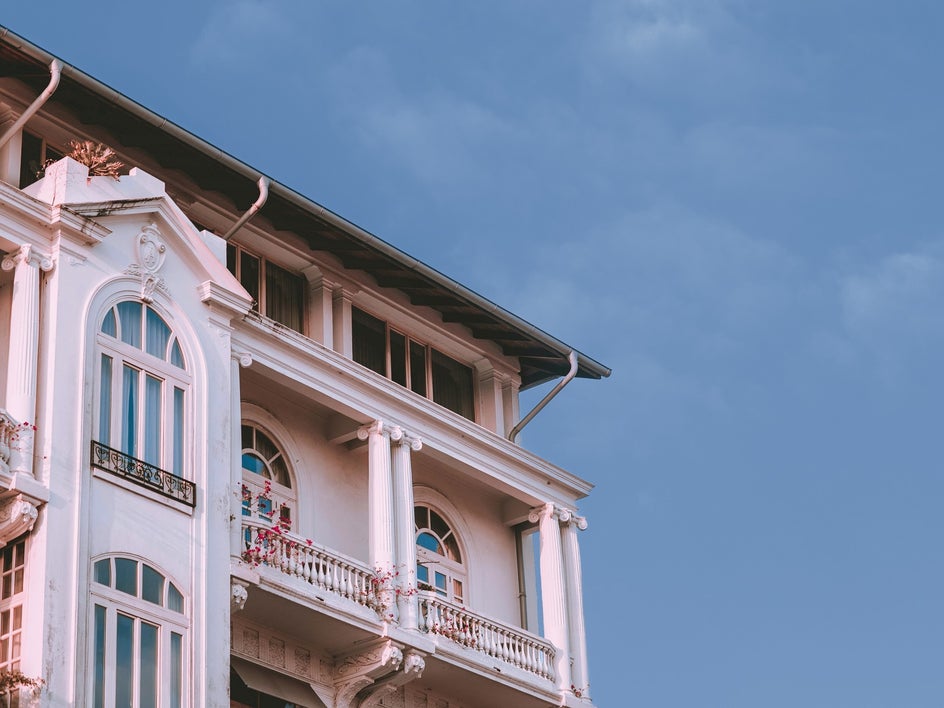 Pink home exterior with grey sky