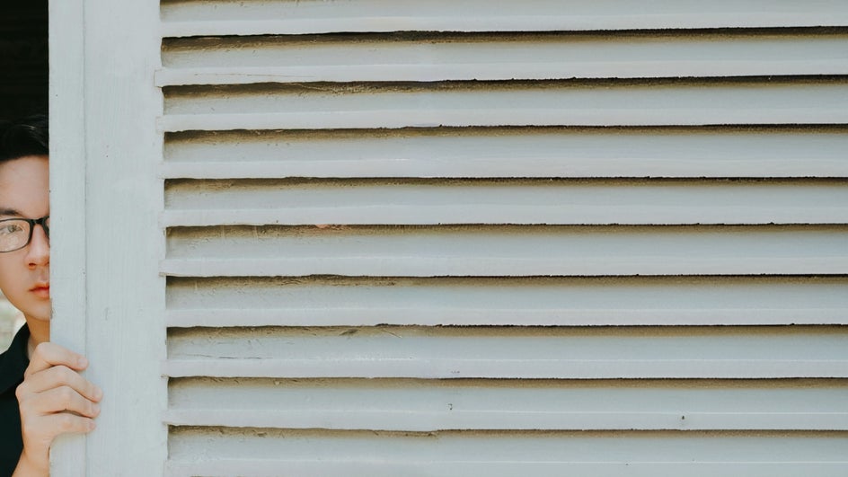 Funny background for Zoom featuring someone peeking at screen.