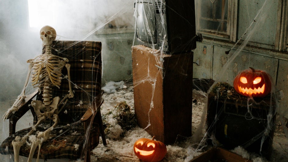 Halloween themed virtual meeting background featuring skeleton.