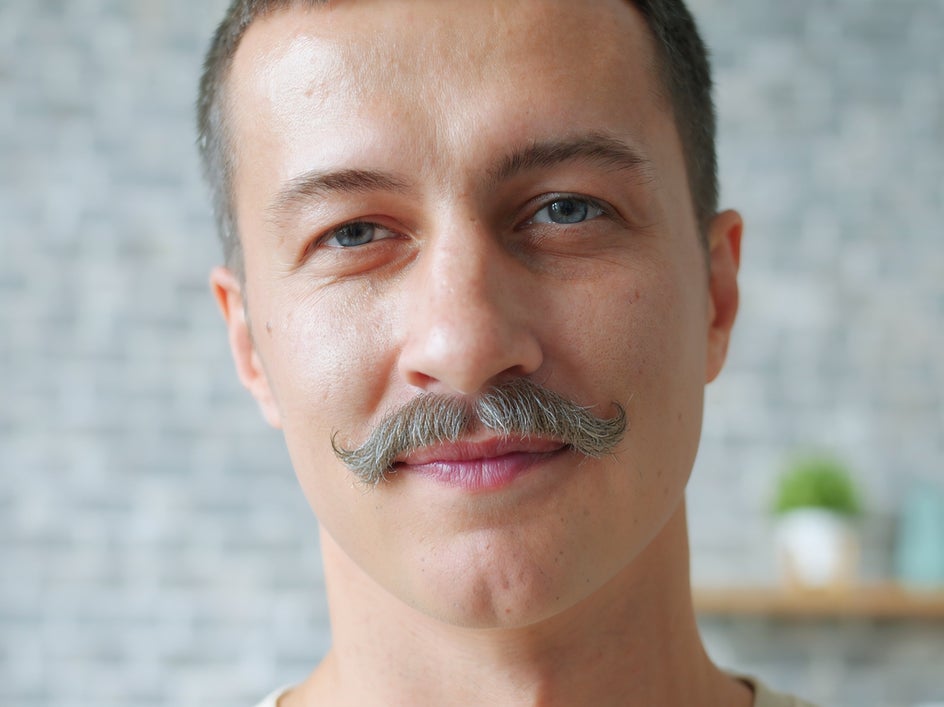 After changing facial hair using ai photo editing smart edit